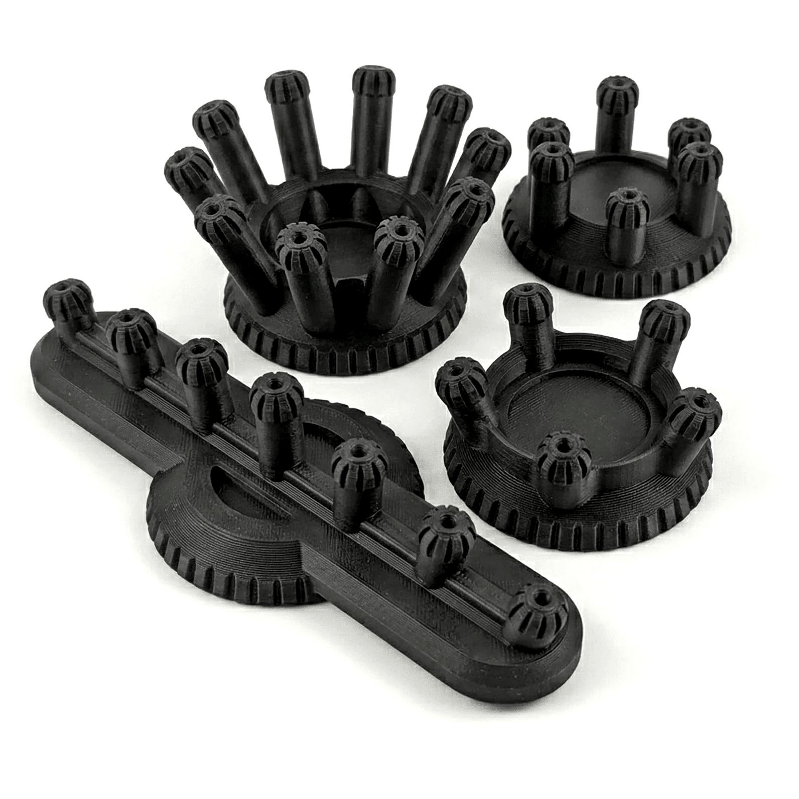 Set of black plastic components on a white background